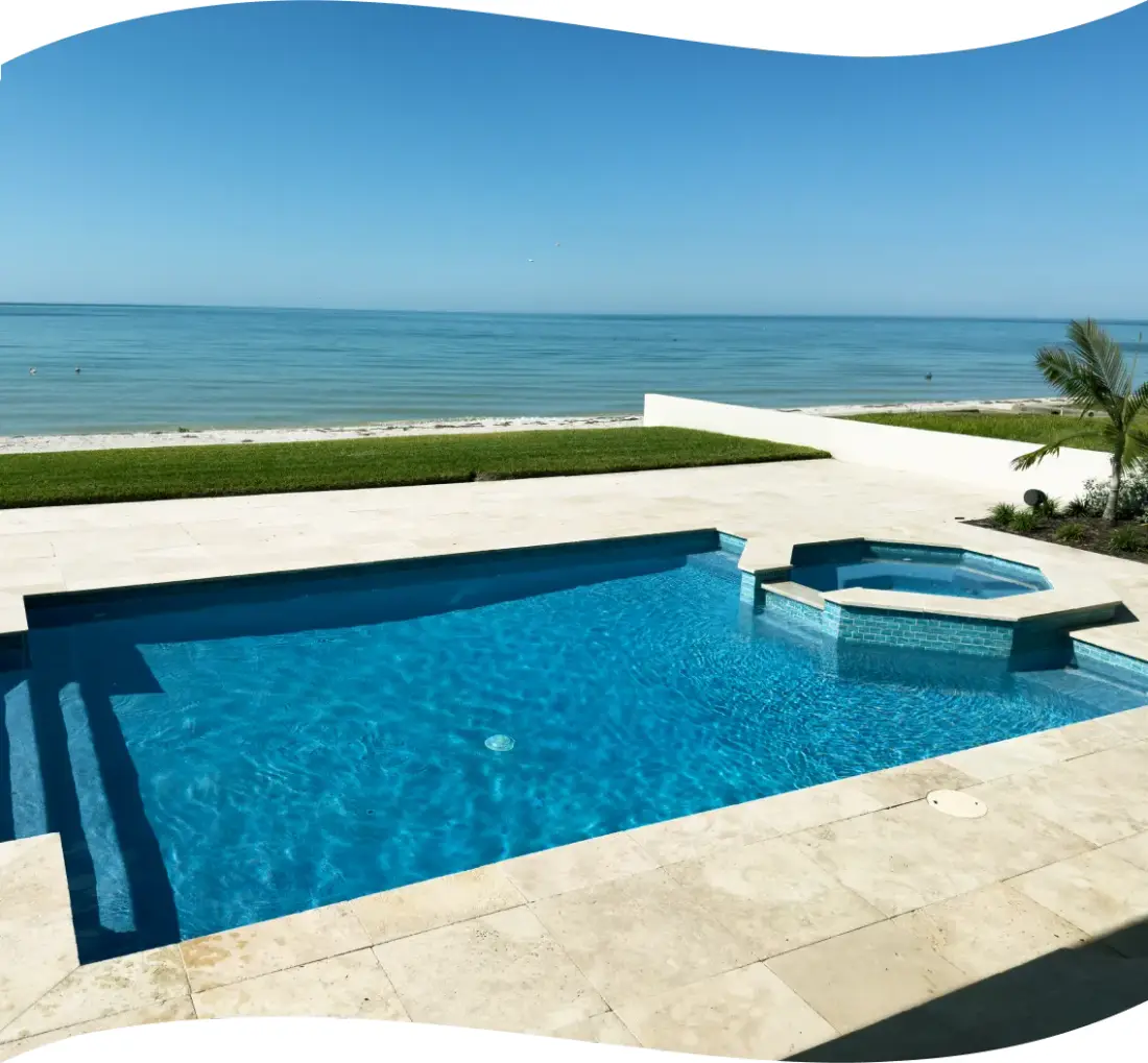 Elevated view of the home's exterior with a rectangular pool and tiled accent band.