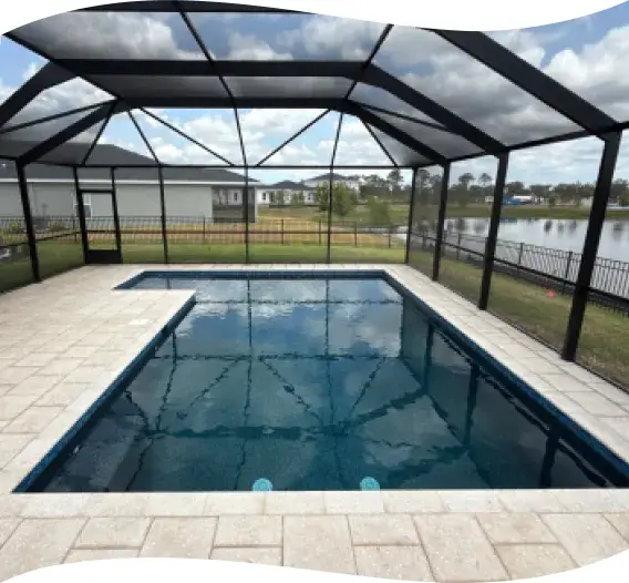 Wide view of the screened pool lanai overlooking a community pond.
