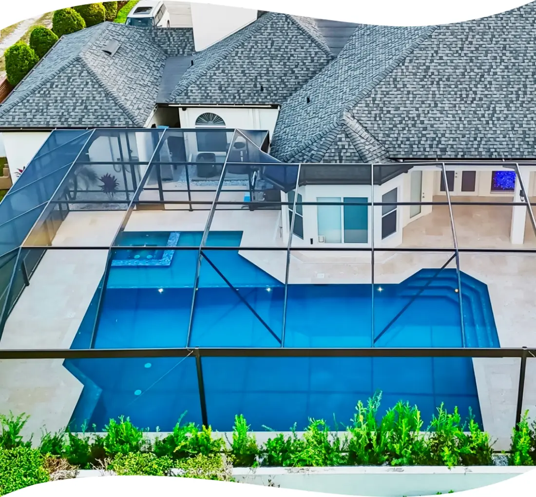 Aerial view straight down on the screened pool enclosure and home roofline.