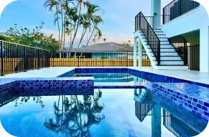 Close view of the pool and spa on the elevated deck from an upper balcony.