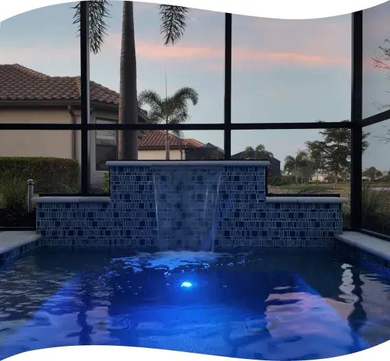 Raised spa at dusk with underwater lighting, water reflecting the evening sky.